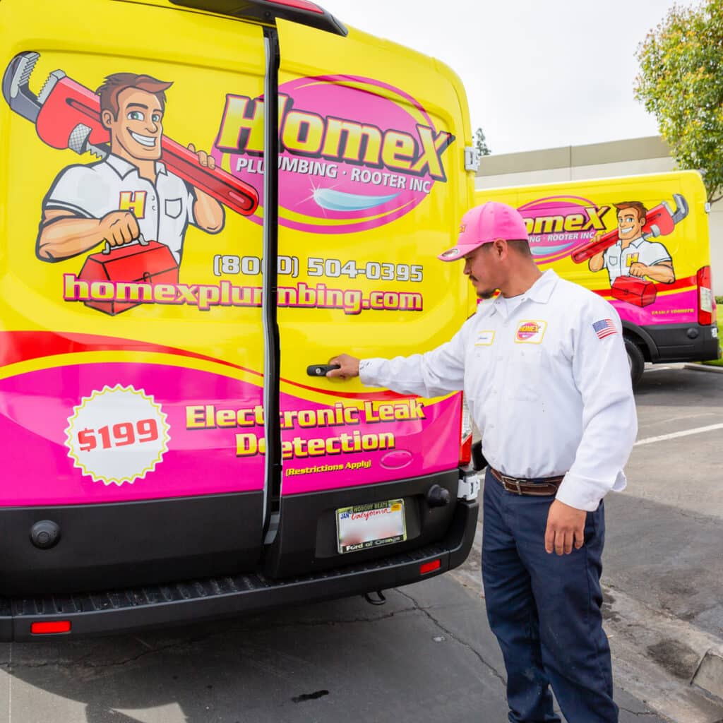 a local plumber opening up a van with HomeX logo on it