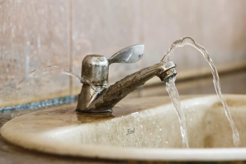 sink in need of water leak repair