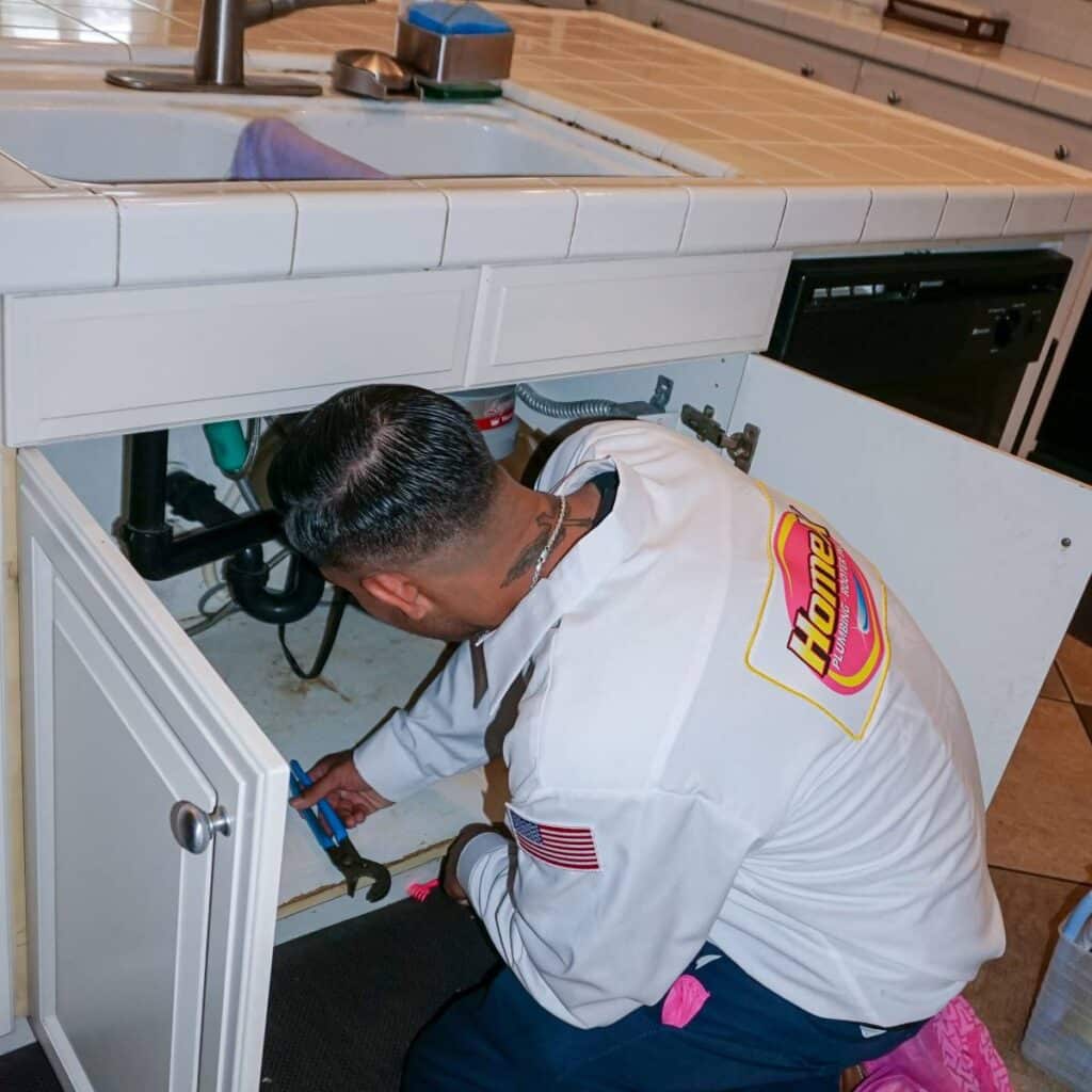HomeX plumber providing a plumbing repair for kitchen sink
